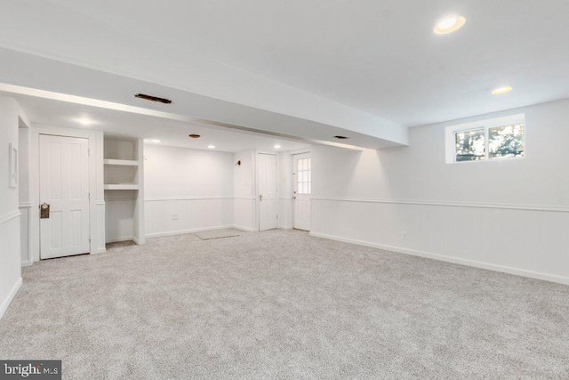 basement with light colored carpet