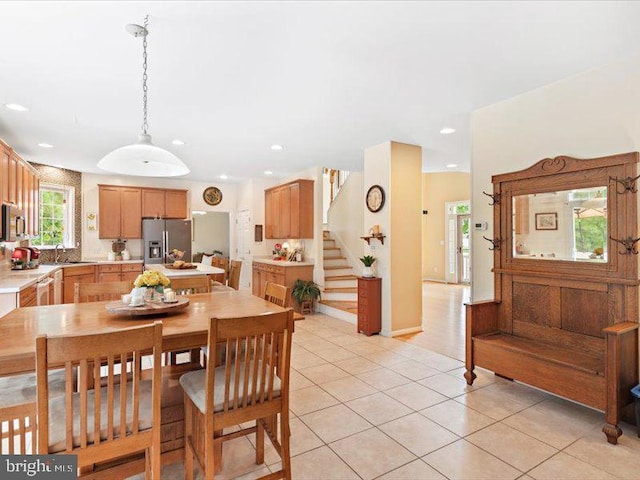 tiled dining room with sink