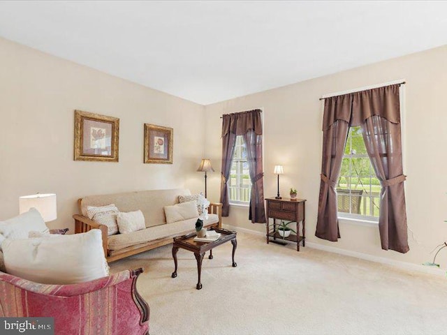 living room featuring light carpet and plenty of natural light