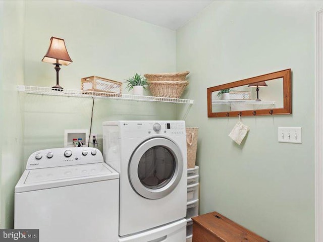 laundry area with independent washer and dryer