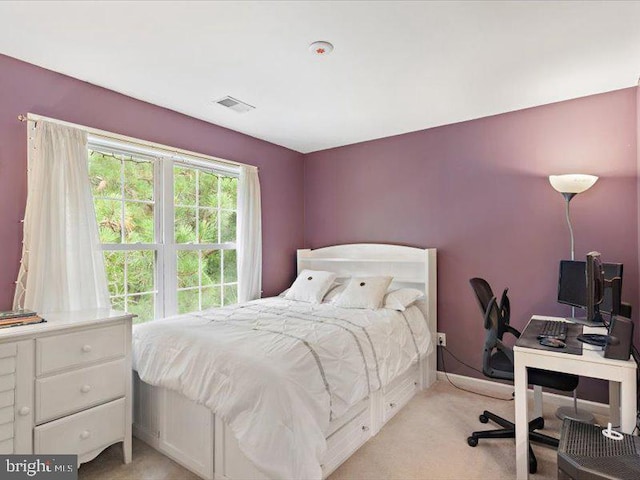 bedroom featuring light colored carpet