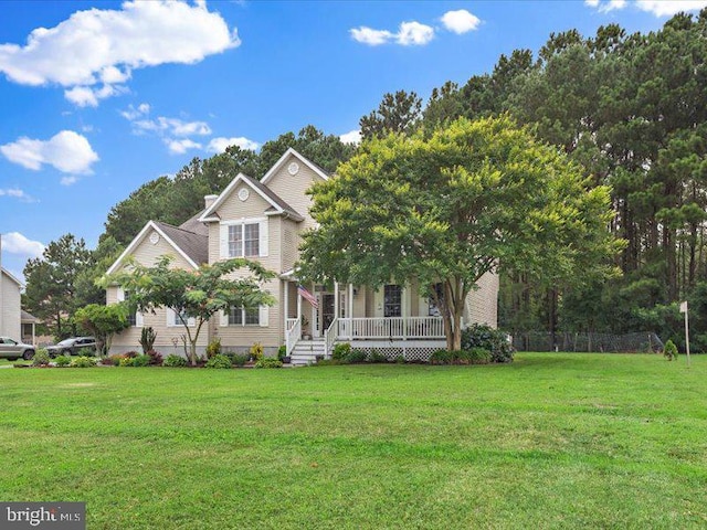 view of front facade with a porch and a front lawn