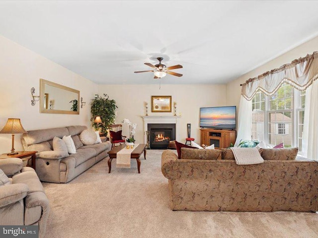 living room featuring light carpet and ceiling fan