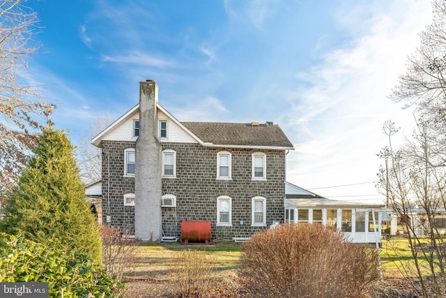 view of front of property with a sunroom