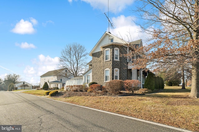 view of front of property with a front lawn