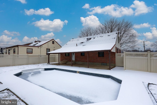 view of snow covered pool