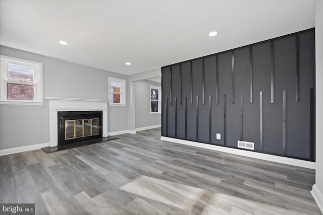 unfurnished living room with light wood-type flooring