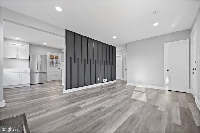 unfurnished living room featuring light hardwood / wood-style floors