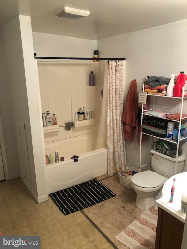 bathroom with shower / bath combination with curtain and toilet