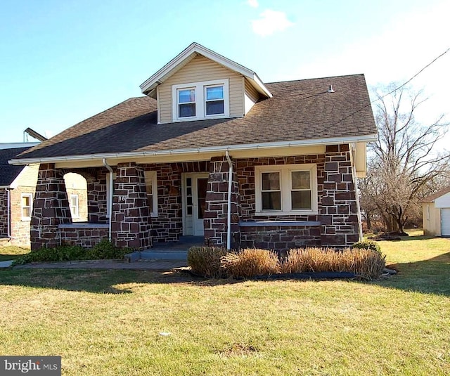 view of front of house with a front lawn and a porch