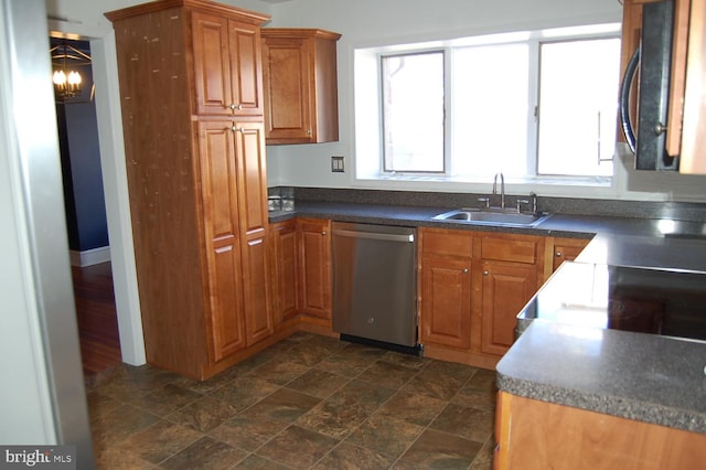 kitchen with sink, stainless steel dishwasher, and a notable chandelier