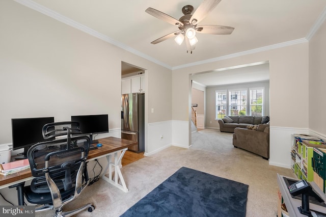 office featuring light carpet, ceiling fan, and crown molding