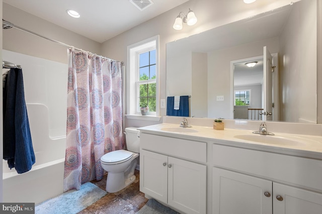 full bathroom with vanity, plenty of natural light, shower / bathtub combination with curtain, and toilet