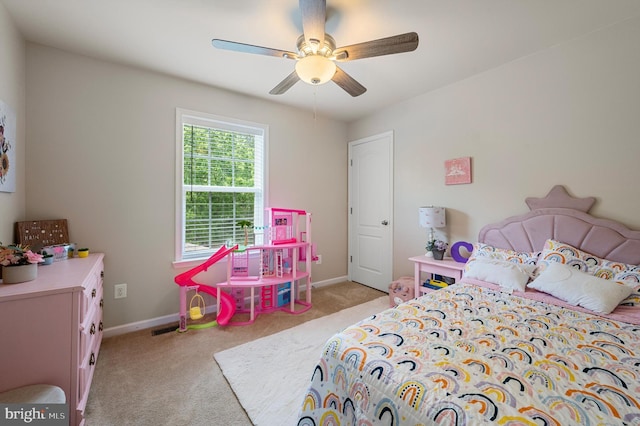 bedroom featuring ceiling fan and light colored carpet