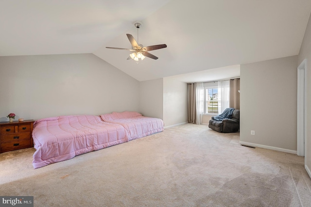 bedroom with light carpet, ceiling fan, and lofted ceiling