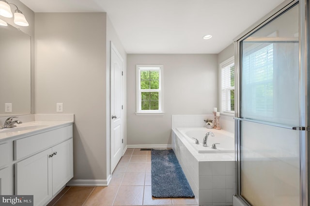 bathroom with tile patterned floors, vanity, and independent shower and bath