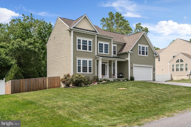 view of front of home with a garage and a front yard