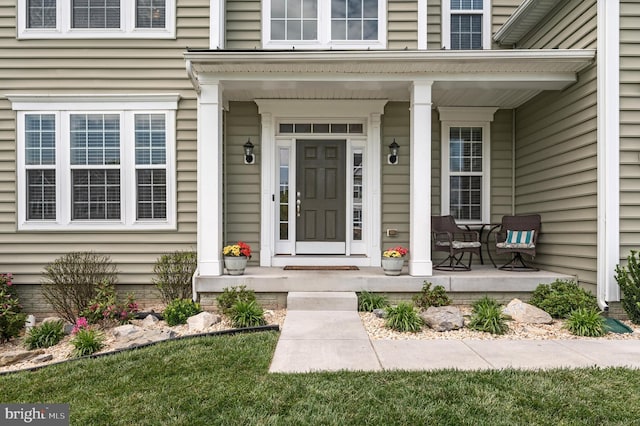 doorway to property featuring covered porch