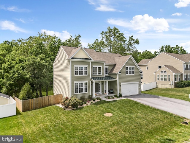 view of front of house with a garage and a front yard