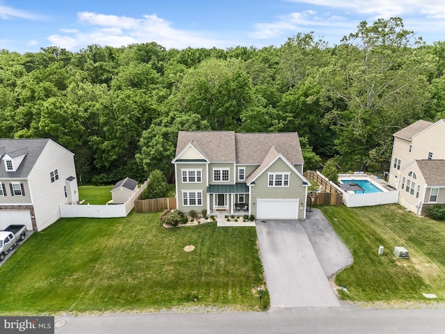 view of front of home featuring a front yard and a garage