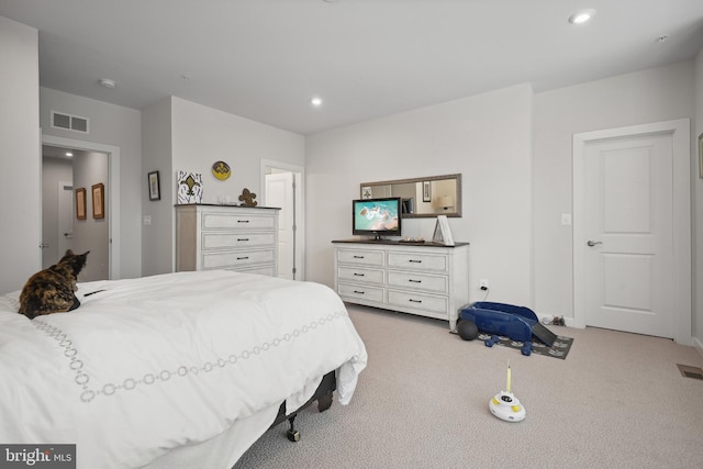 bedroom featuring light colored carpet