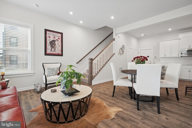 dining room with dark hardwood / wood-style floors