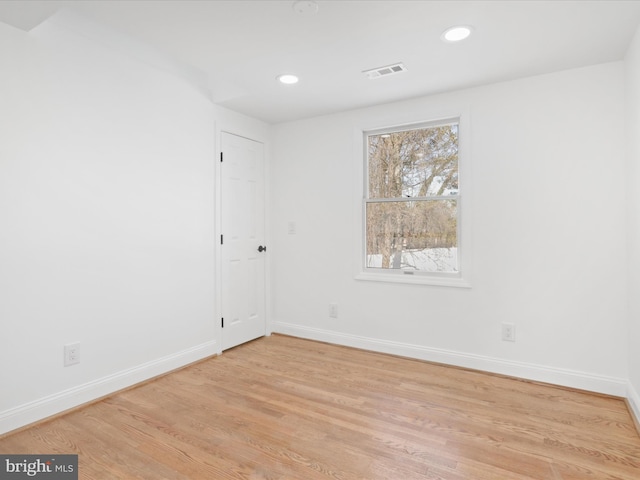 unfurnished room featuring light wood-type flooring