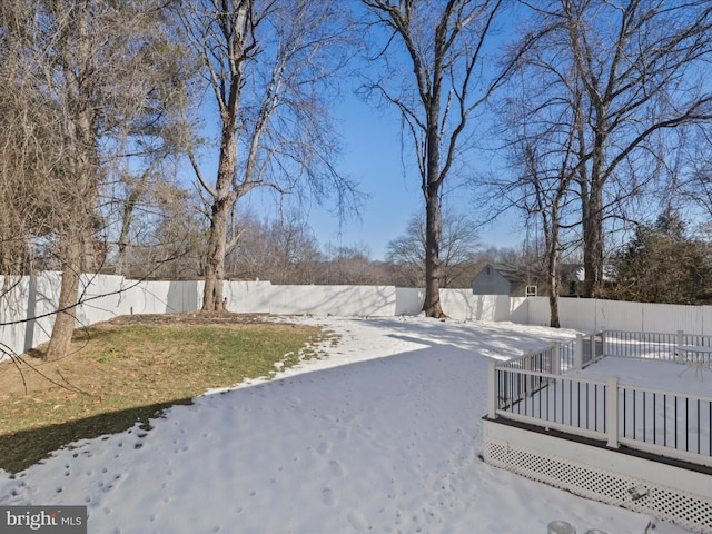 view of yard layered in snow