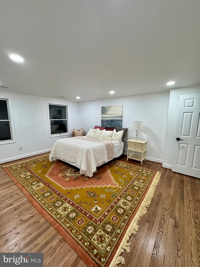 bedroom with hardwood / wood-style flooring