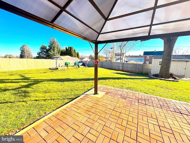 view of patio / terrace featuring a gazebo and a water view