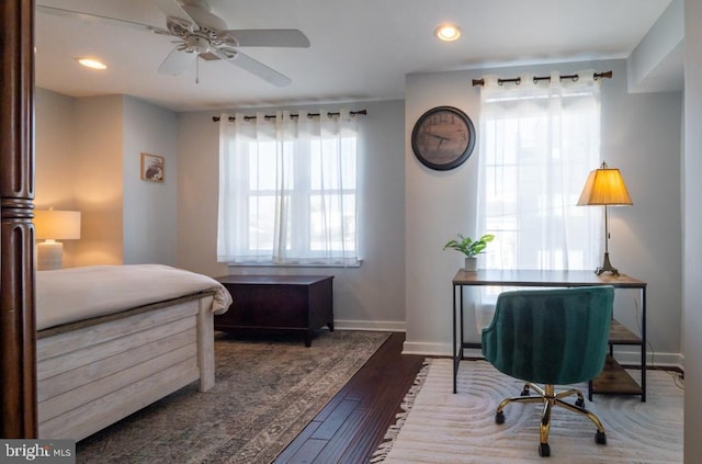 bedroom with dark hardwood / wood-style flooring