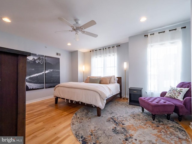 bedroom with ceiling fan and wood-type flooring