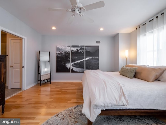 bedroom with hardwood / wood-style flooring and ceiling fan