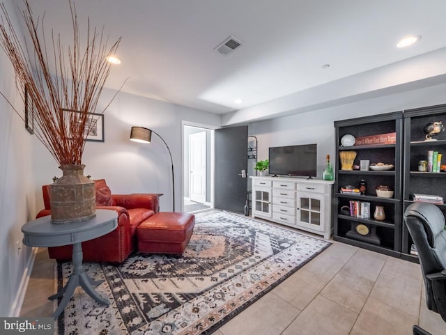 living room with light tile patterned flooring