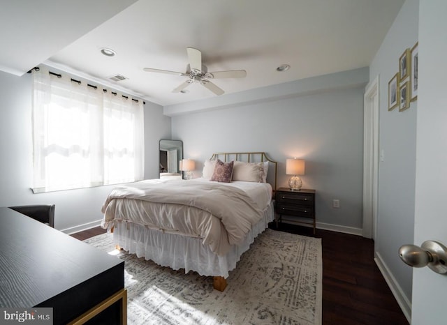 bedroom featuring ceiling fan and dark hardwood / wood-style flooring