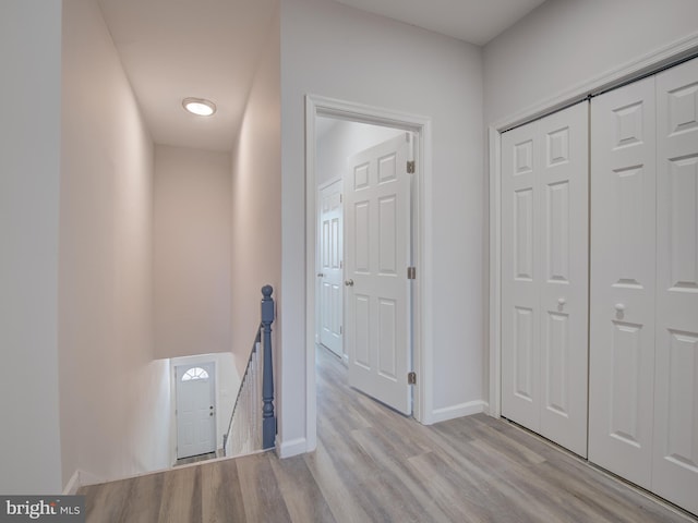 hall with light hardwood / wood-style flooring