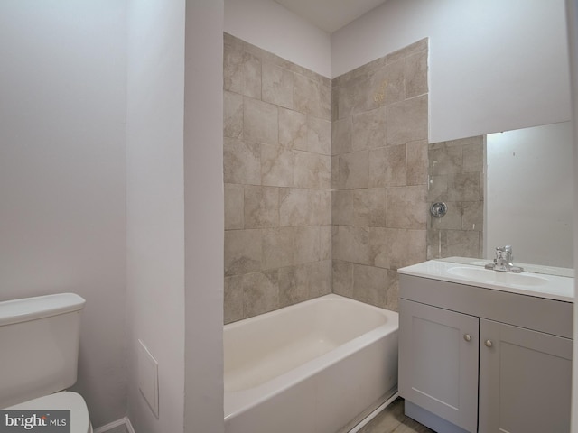 full bathroom with vanity, toilet, and tiled shower / bath