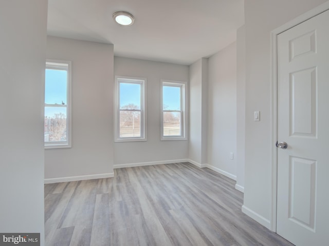 spare room featuring light hardwood / wood-style floors