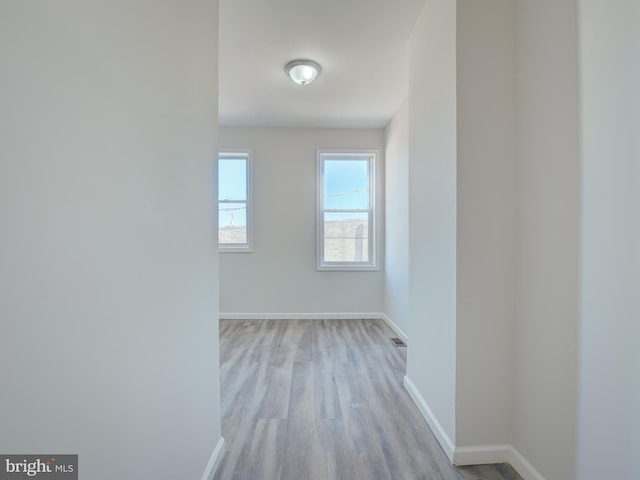 corridor featuring light hardwood / wood-style floors