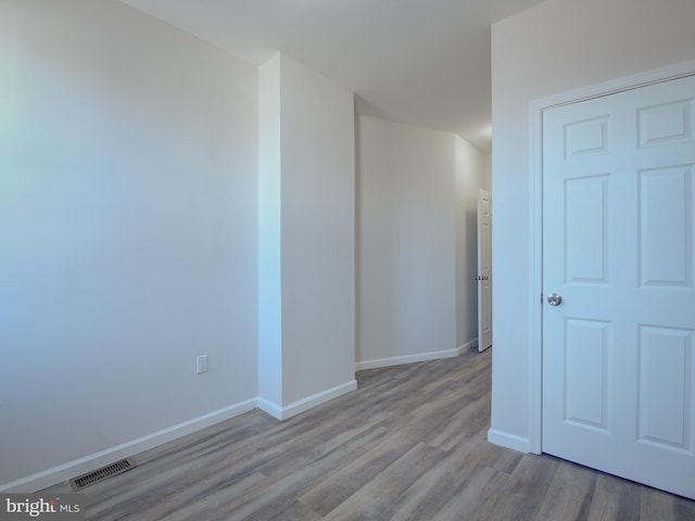 spare room with light hardwood / wood-style floors