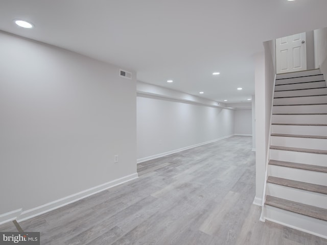 basement featuring light hardwood / wood-style flooring