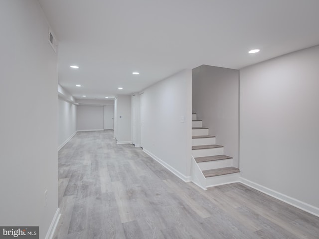 basement featuring light wood-type flooring