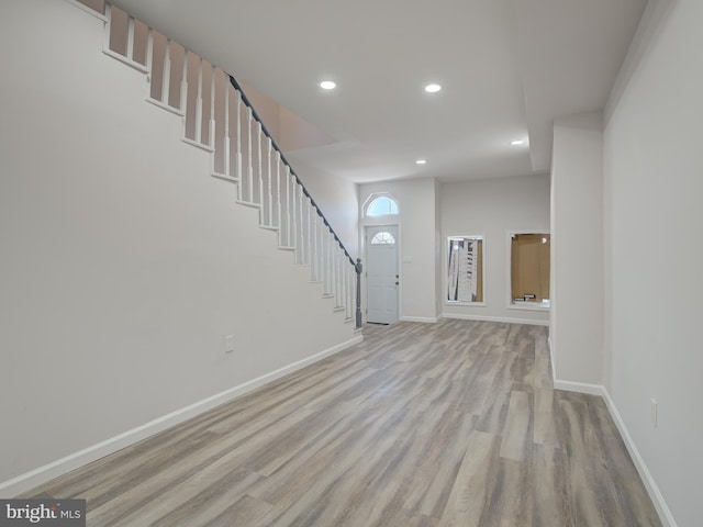 foyer entrance with light hardwood / wood-style flooring