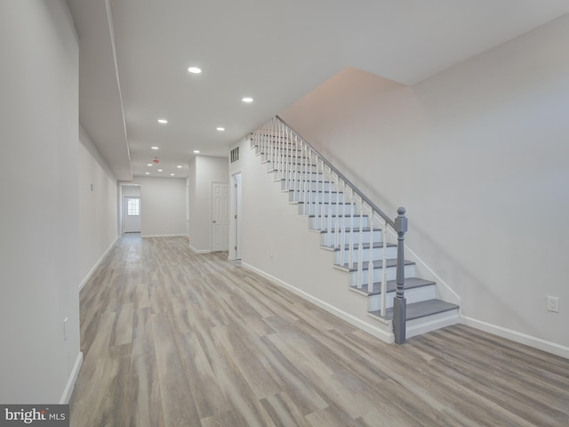 unfurnished living room with light wood-type flooring