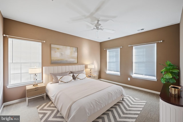 carpeted bedroom featuring ceiling fan