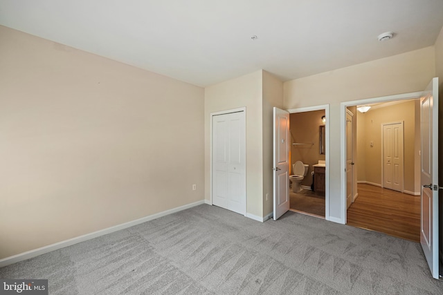 unfurnished bedroom with light carpet