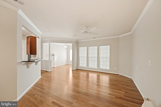 unfurnished living room featuring crown molding, light hardwood / wood-style flooring, and ceiling fan