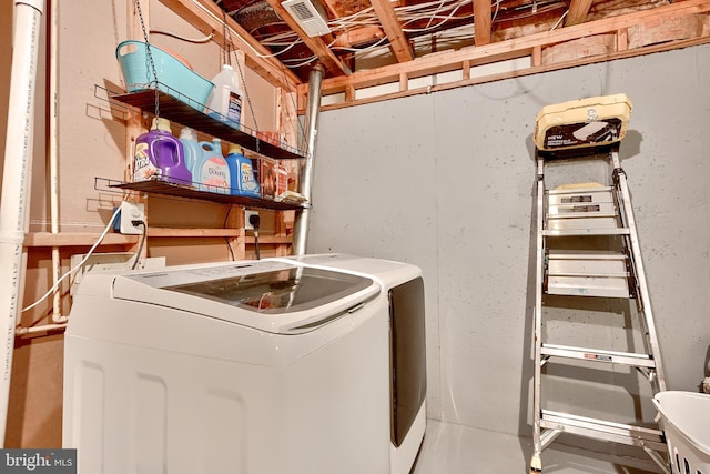 laundry area featuring washing machine and clothes dryer