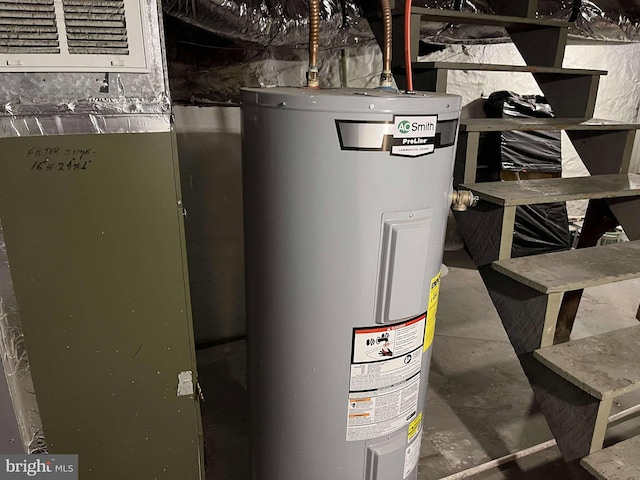 utility room with electric water heater