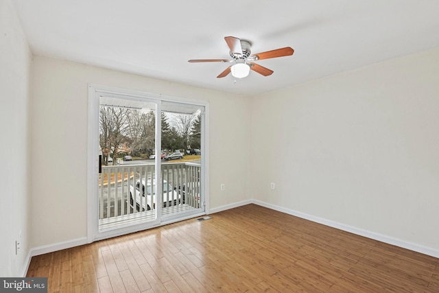 empty room with ceiling fan and wood-type flooring